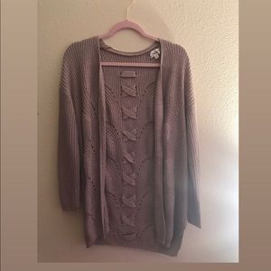 A Lilac Cardigan with designed “X”s on The Back